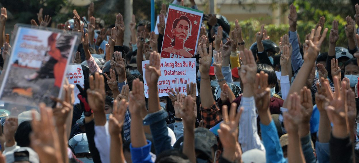 Protesters hold up the three finger salute during a demonstration against the military coup in Naypyidaw on 12, February, 2021. (Photo: STR/ AFP)