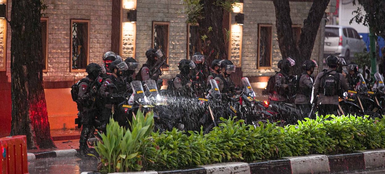 A police security team guard the entrance to the Indonesia National Police Headquarters in Jakarta on 31 March, 2021, after gunfire was heard in the compound. (Photo: Mariana/ AFP)