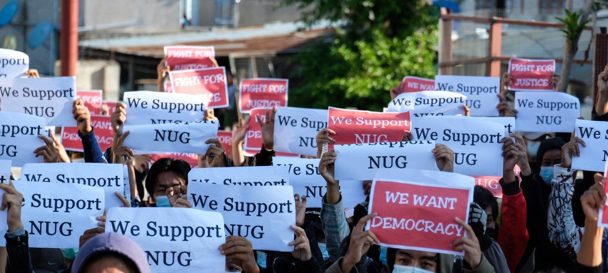 Protestors hold posters in support of the National Unity Government (NUG) during a demonstration against the military coup on “Global Myanmar Spring Revolution Day” in Taunggyi, Shan state on 2 May, 2021. (Photo: STR/ AFP)