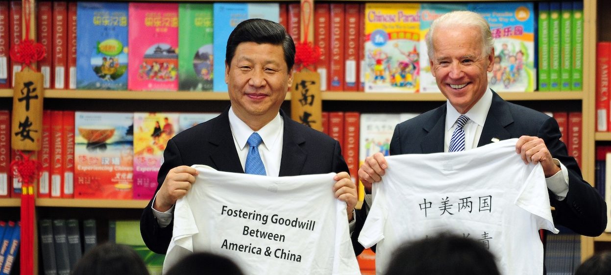 Then US Vice President Joe Biden and his Chinese counterpart Xi Jinping display shirts with a message given to them by students at the International Studies Learning School in Southgate, outside of Los Angeles, on 17, February, 2012. (Photo by Frederic J. BROWN/ AFP)