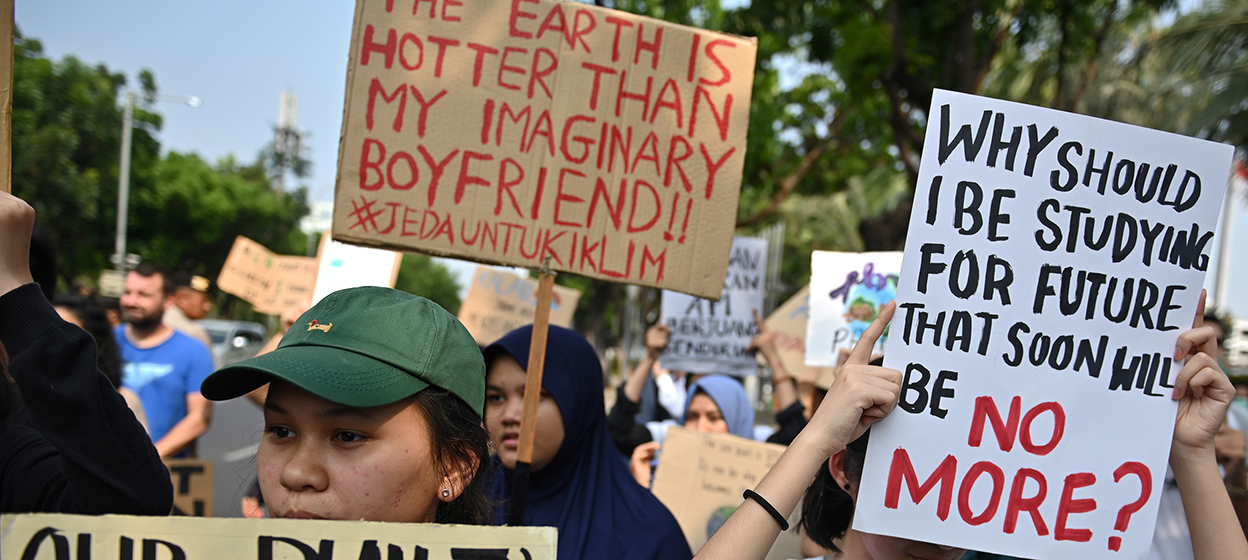 Indonesian activists participate in a rally calling for action against climate change