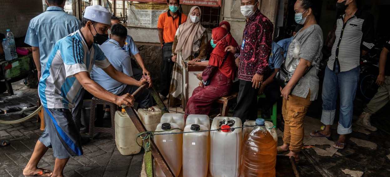 People queue to purchase cooking oil in Surabaya