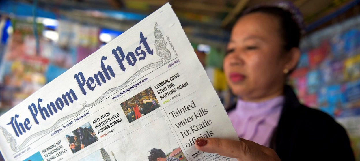 Cambodian newspaper vendor
