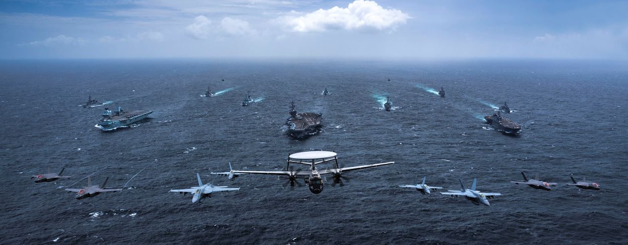 Ships and aircraft from the US Navy, Royal Australian Navy, Japan Maritime Self-Defense Force and the UK Royal Navy transit in formation as part of Maritime Partnership Exercise (MPX) 2021