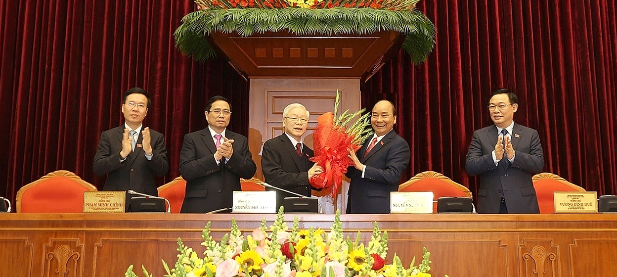 Prime Minister Nguyen Xuan Phuc is seen congratulating the new Communist Party general secretary Nguyen Phu Trong in Hanoi.